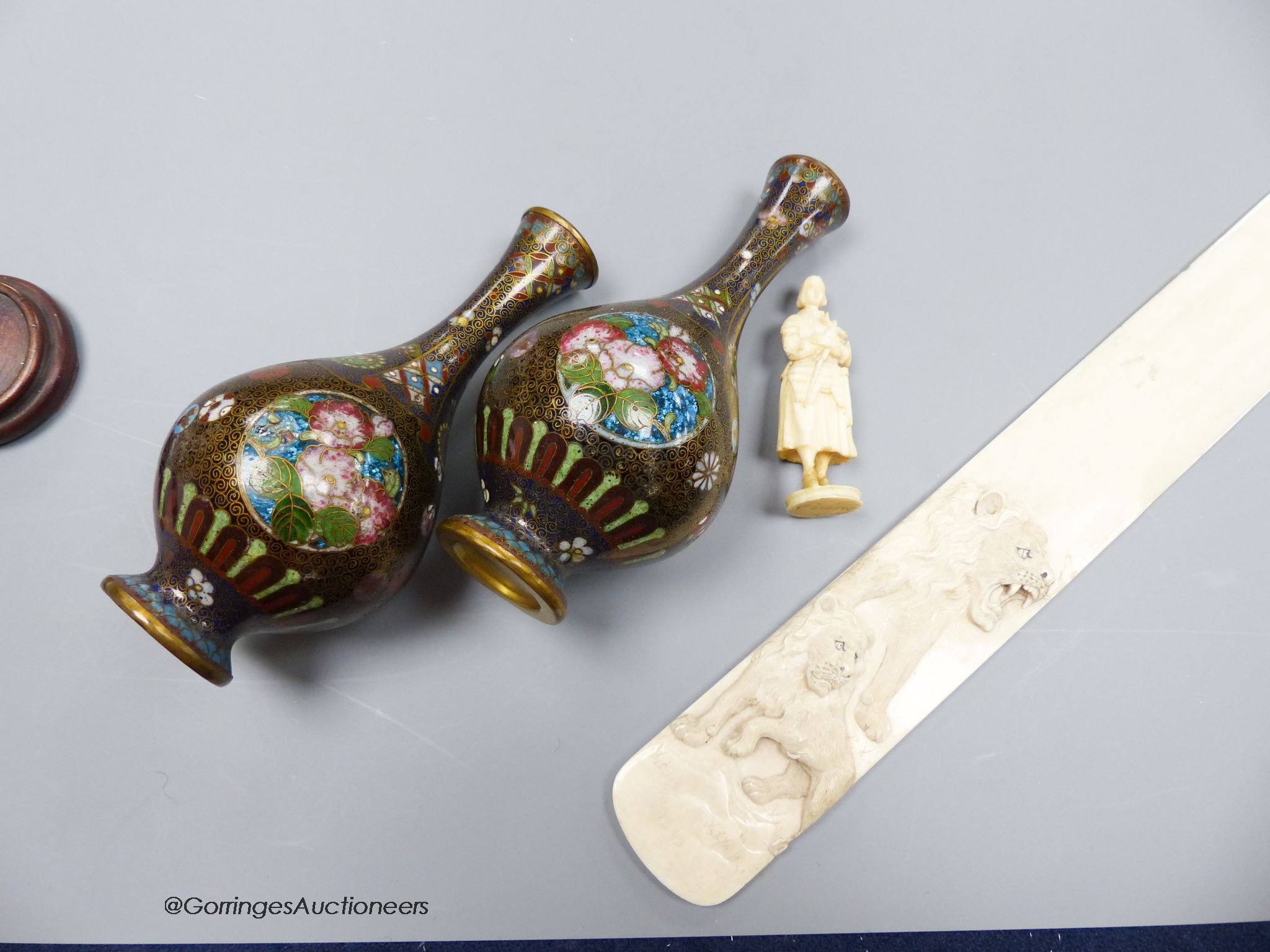 A pair of Japanese cloisonne miniature vases, a carved ivory paper knife, length 37cm, and a carved ivory figure